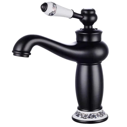 Bathroom faucet with antique bronze finish, solid brass, single-handle design and white ceramic floral accents.