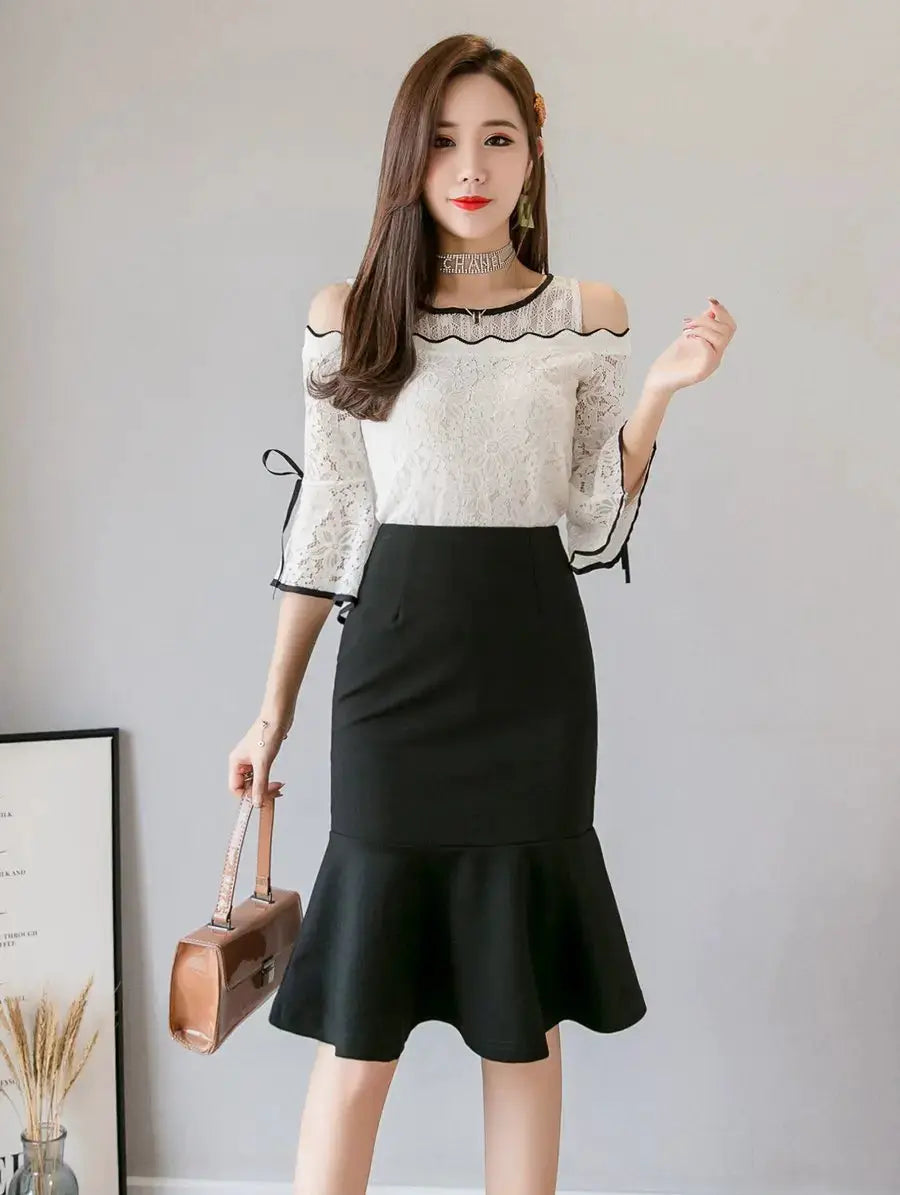 Women's black high-waist mermaid midi skirt with a flared ruffle hem
