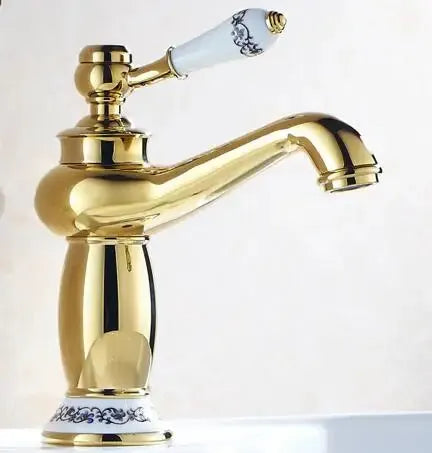 Antique-brass bathroom faucet with single white ceramic handle and solid brass body.