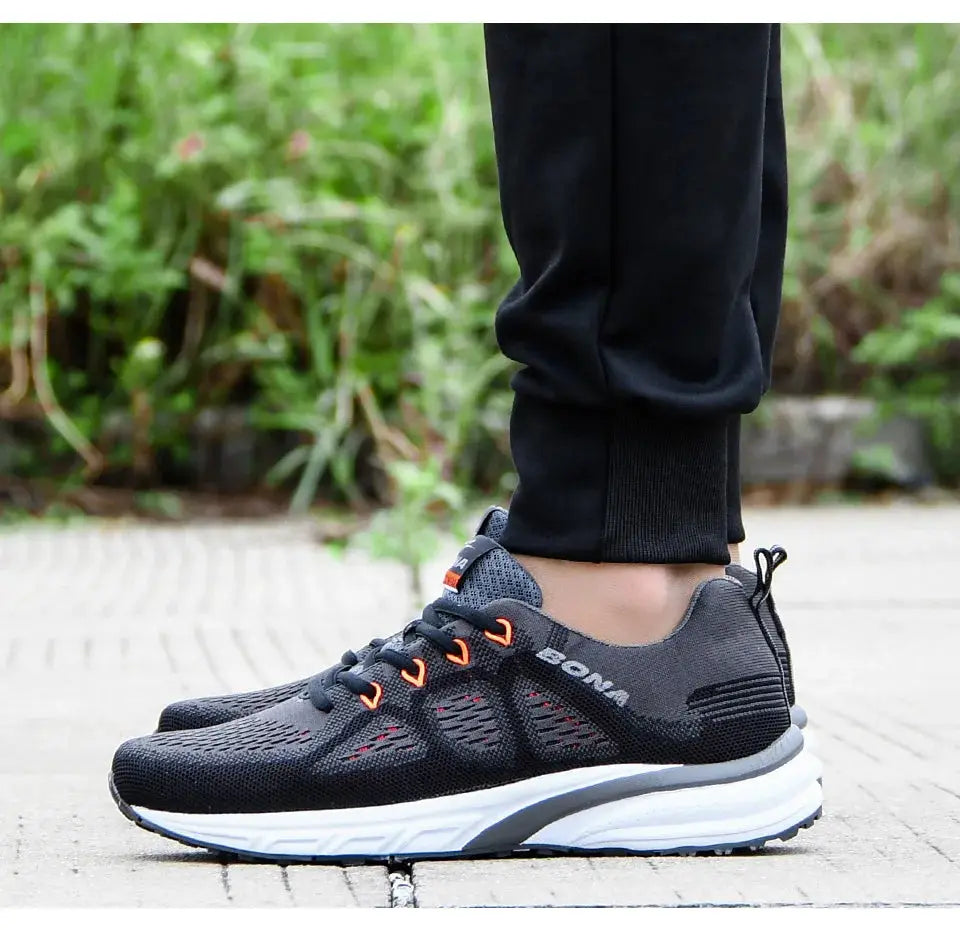 BONA men's black mesh sneakers with orange eyelets and white sole