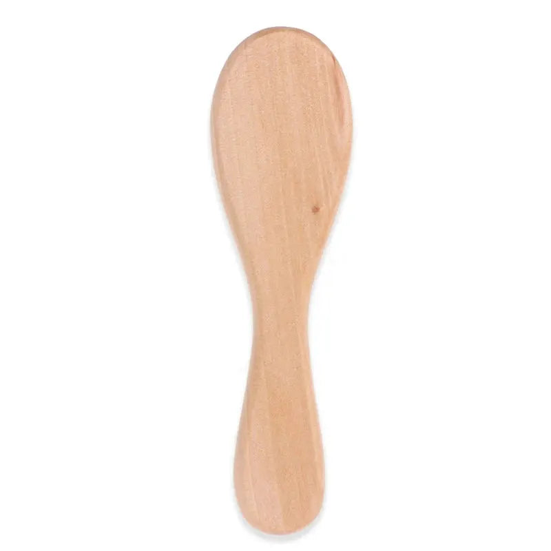 Wooden-handle baby hairbrush by Simples Market with natural wood finish for newborns
