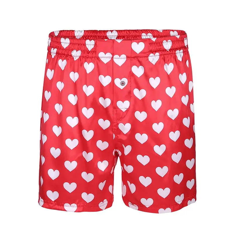 Men's heart-print boxer shorts, red with white hearts, lightweight beachwear style.