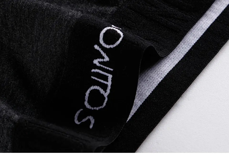 Men's black long-leg boxer shorts with white Simples Market branding on waistband.
