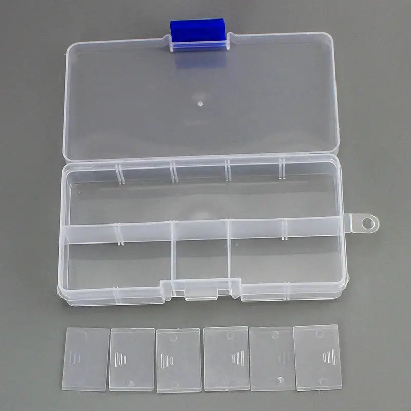10-slot clear plastic jewelry storage box with blue latch; five clear lids laid out beside it