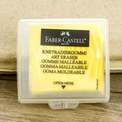 Faber-Castell kneaded eraser in clear plastic case with yellow wrapper, gray eraser