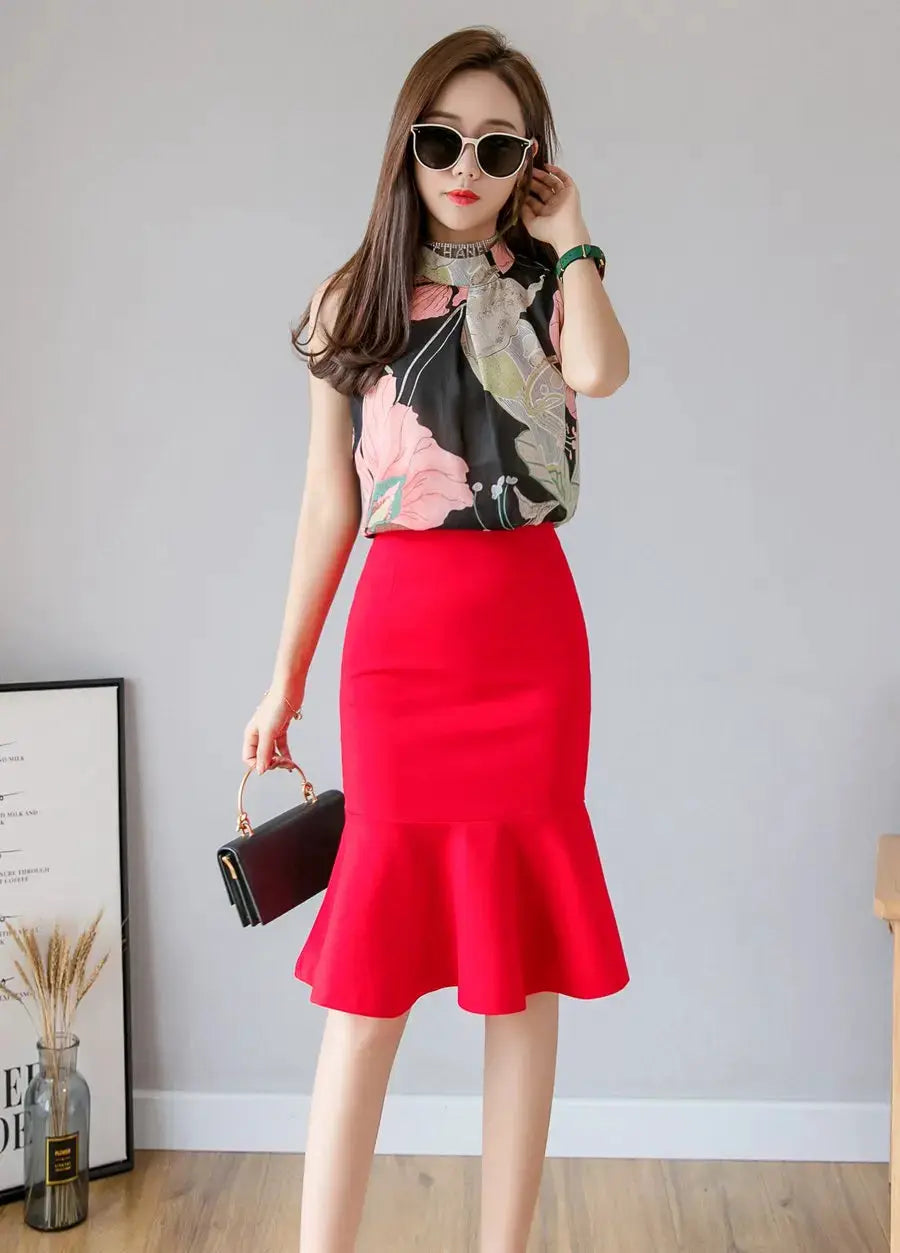 Women's red high-waist midi skirt with a flared ruffle hem, shown with a floral blouse.