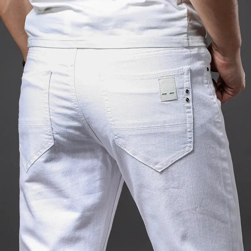Men's white jeans back view, slim-fit casual trousers with back pockets and small brand tag