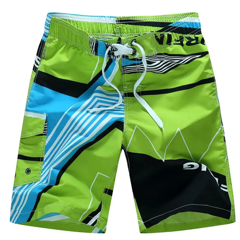 Men's lime green surf board shorts with blue and black geometric print, white drawstring, cargo pocket.