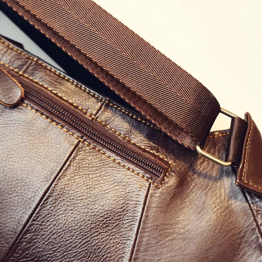 Men's brown genuine leather crossbody sling bag with zip pocket and wide strap