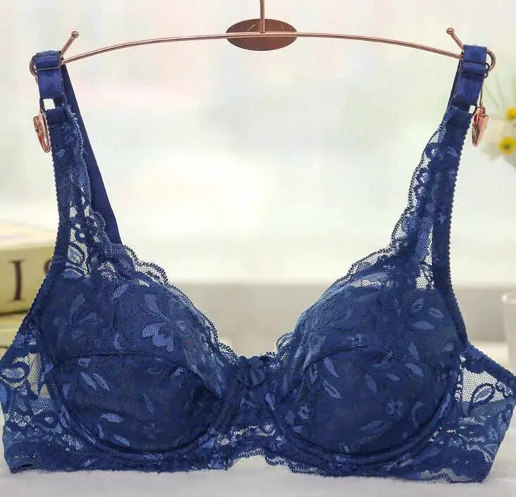 Women's navy blue lace underwire push-up bra by Simples Market on hanger