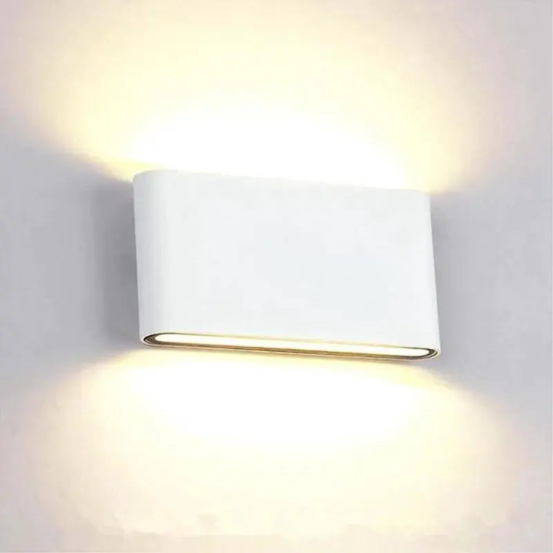Simples Market LED wall lamp; outdoor waterproof aluminum, white finish with warm glow.