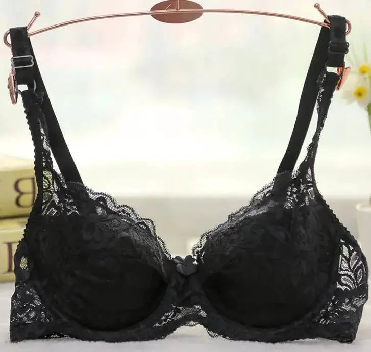 Women's black lace underwire push-up bra with bow center and adjustable straps