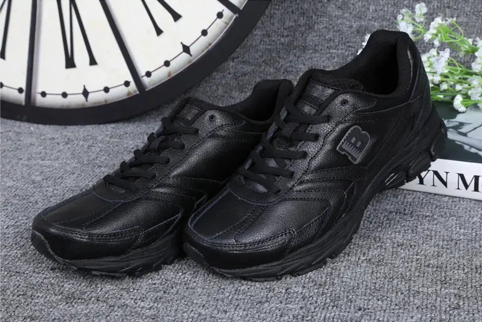Pair of men's black leather running shoes, lace-up athletic sneakers, Simples Market.