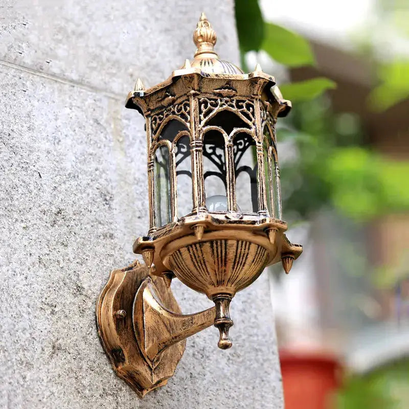 Retro outdoor wall lantern in antique bronze finish, ornate metalwork, waterproof E27 garden sconce