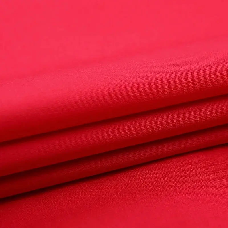 Classic winged-collar dress shirt fabric in red, folded close-up