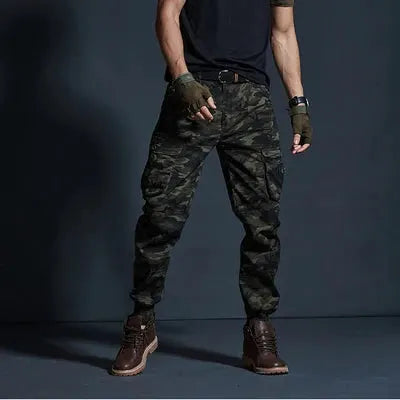 Men's camouflage cargo joggers by Simples Market with multi-pocket design in dark green camo.