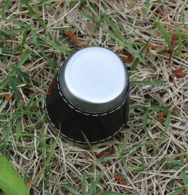 Stainless steel travel cup with black PU leather sleeve