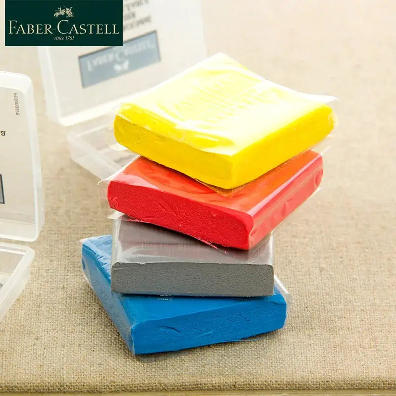 Faber-Castell Plasticity eraser set in yellow, red, gray, blue stacked for art and sketching
