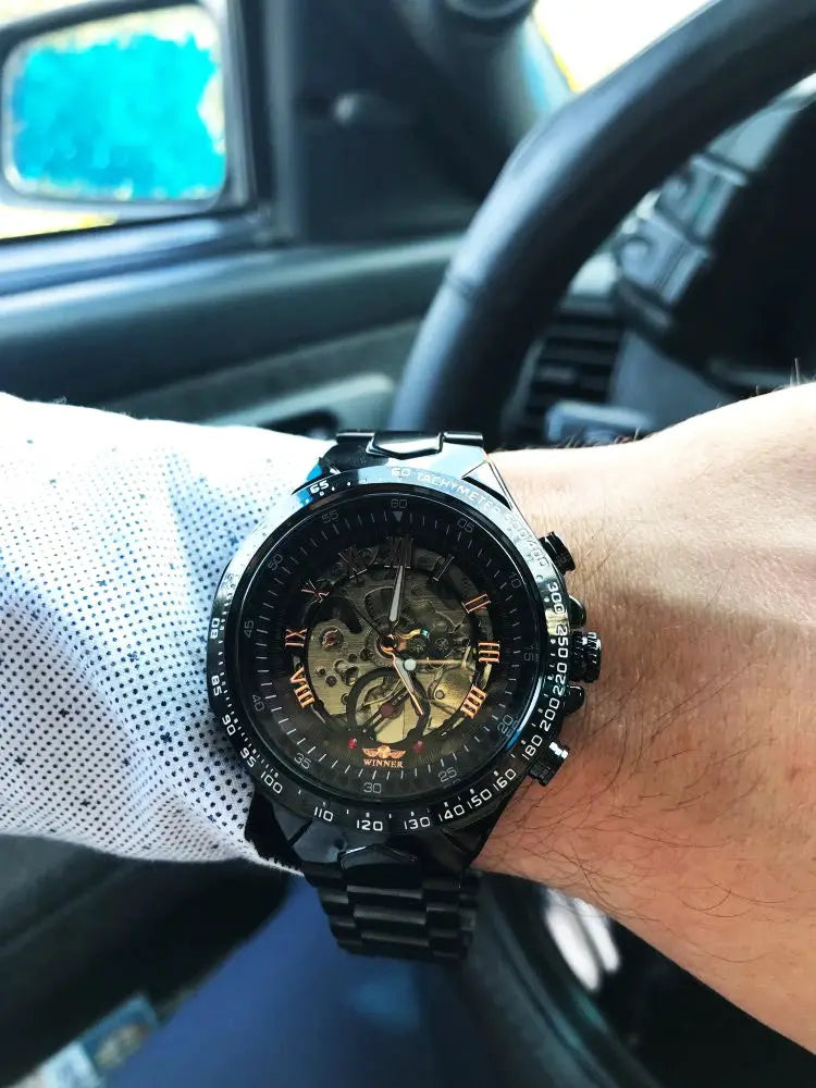 Winner mechanical skeleton watch for men with black stainless steel band and tachymeter bezel