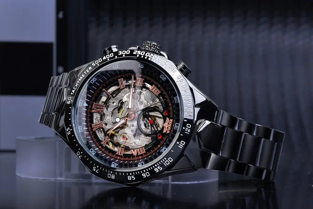 Winner mechanical skeleton watch, black stainless steel band, rose-gold Roman numerals and tachymeter bezel.