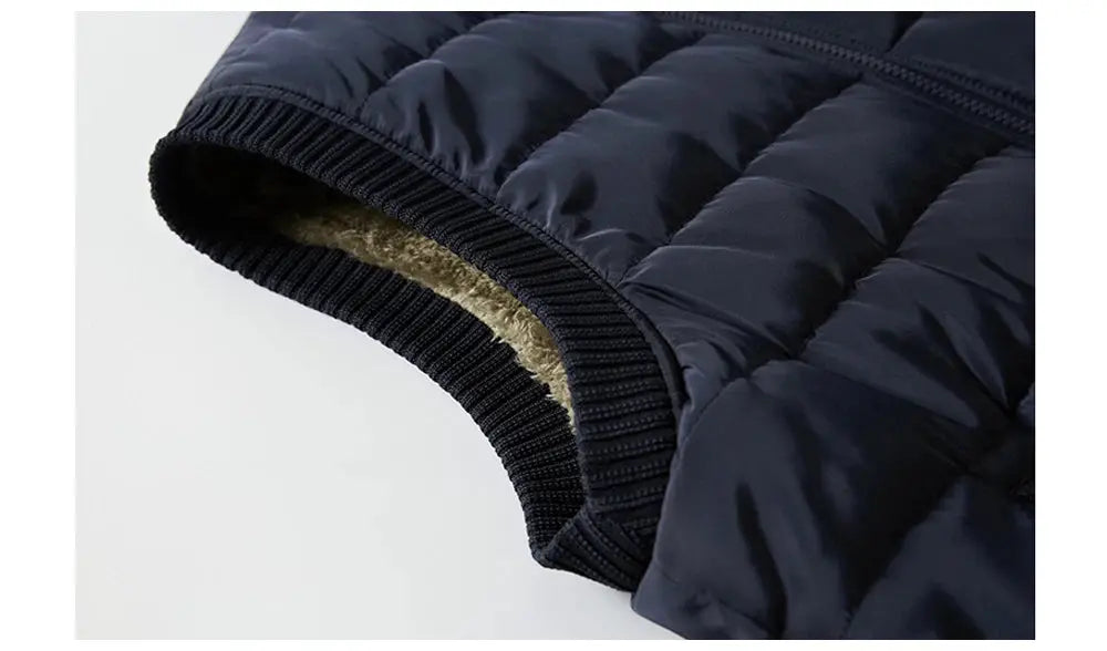 Men's navy blue padded jacket with ribbed cuffs and fleece lining.