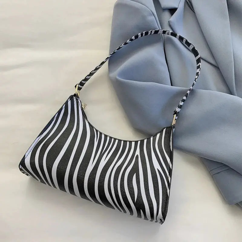 Simples Market zebra print PU leather shoulder bag for women, zebra-striped crescent purse with matching strap