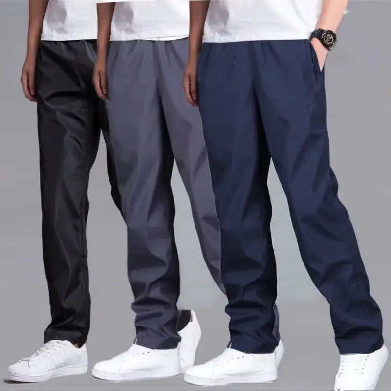 Men's velvet-warm sweatpants, three pairs in black, gray, and navy with a loose straight fit.