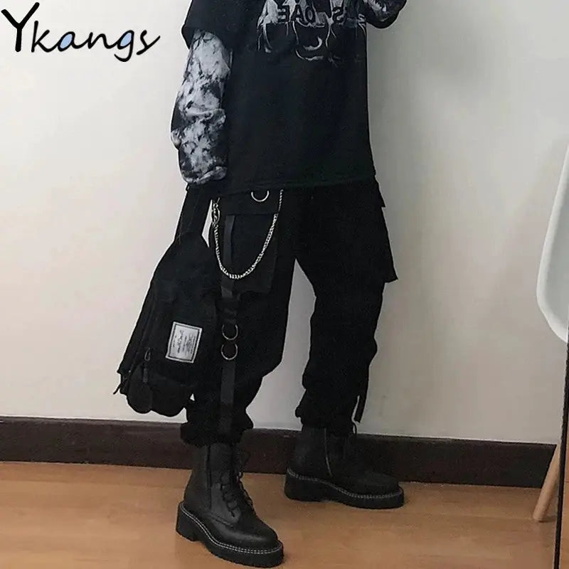 Women's black mid-sleeve blouse by Ykangs; loose-fit top paired with cargo pants and combat boots