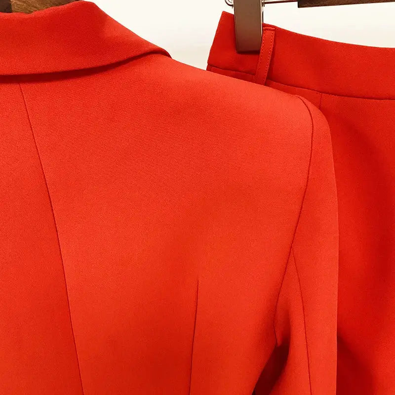 Red two-piece women's blazer suit by Simples Market with flare pants