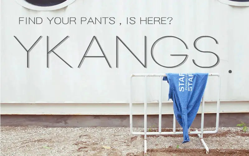 Womens summer blouse on display; blue garment draped over a white rack beneath a YKANGS sign