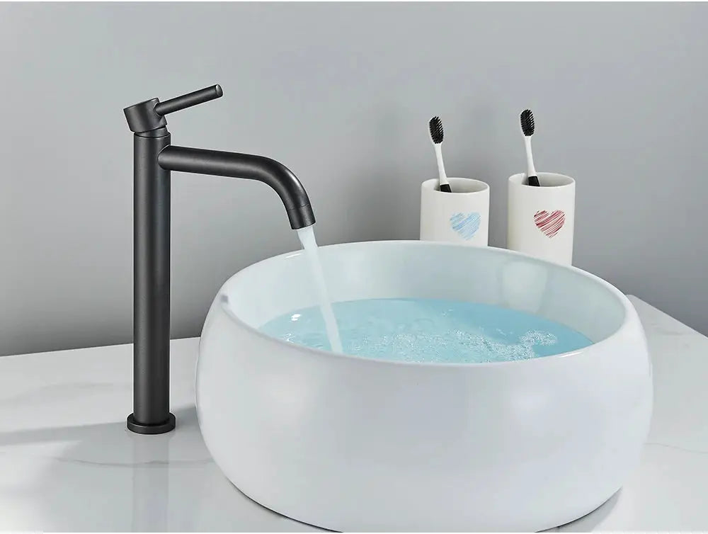Black matte basin faucet with curved spout for bathroom sink by Simples Market