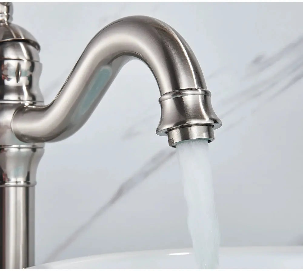 Basin faucet in brushed stainless steel finish, deck-mounted single-hole mixer with high-arc curved spout