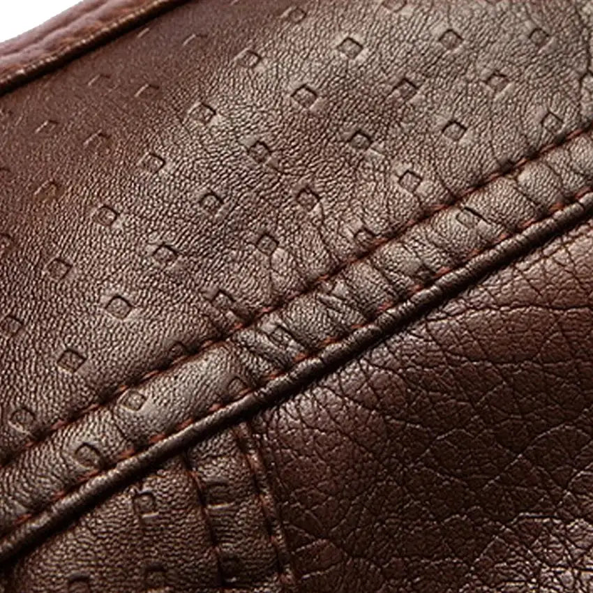 Brown PU leather jacket close-up for men, textured grain with double-stitched seams and premium finish.
