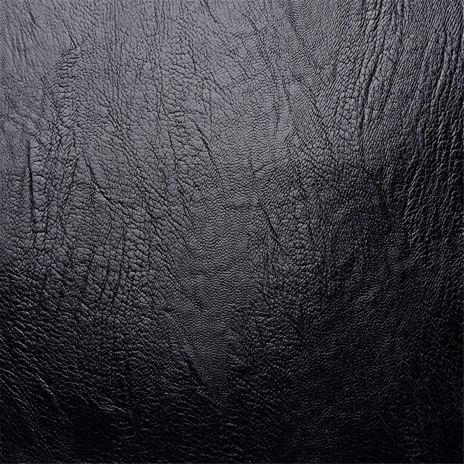 Black leather texture close-up showing detailed grain pattern