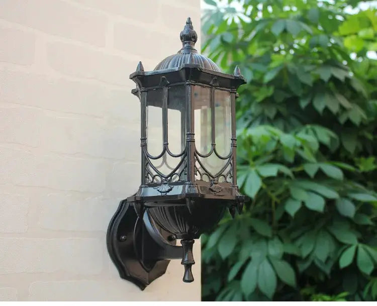 Retro outdoor waterproof E27 wall lamp in black antirust metal with glass panels, wall-mounted garden sconce.