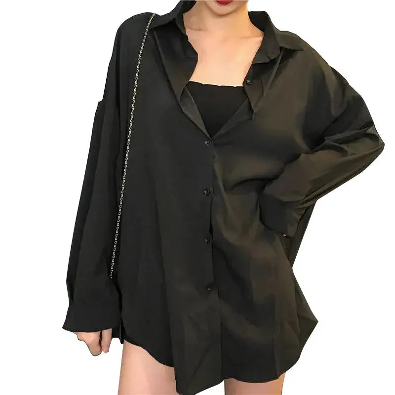 Oversize black women's button-up shirt with long sleeves and relaxed fit