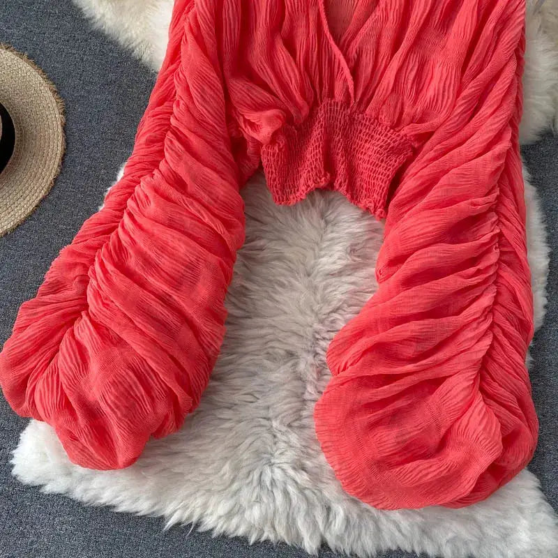 Simples Market red draped chiffon blouse with V-neck, puff long sleeves, elastic smocked waist.