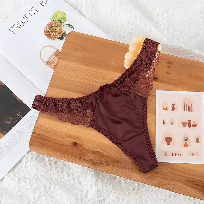 Lace thong underwear in burgundy by Simples Market with wide lace sides and satin front, low waist