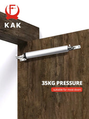 KAK door closer, pneumatic 35kg pressure, silver metal body mounted on a wooden door