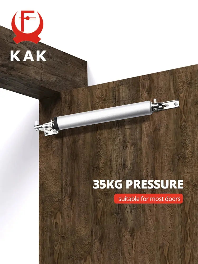 KAK door closer, pneumatic 35kg pressure, silver metal body mounted on a wooden door