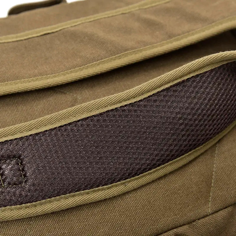 Canvas backpack with tan body and dark brown strap trim