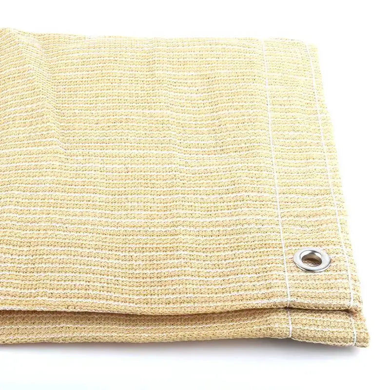 Beige HDPE shade net fabric with metal grommet for pergola or privacy screen.