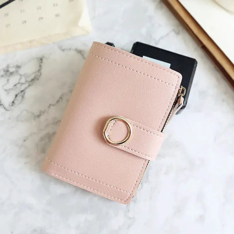 Pink PU leather wallet with zipper pocket and circular ring strap; compact women's card holder by Simples Market