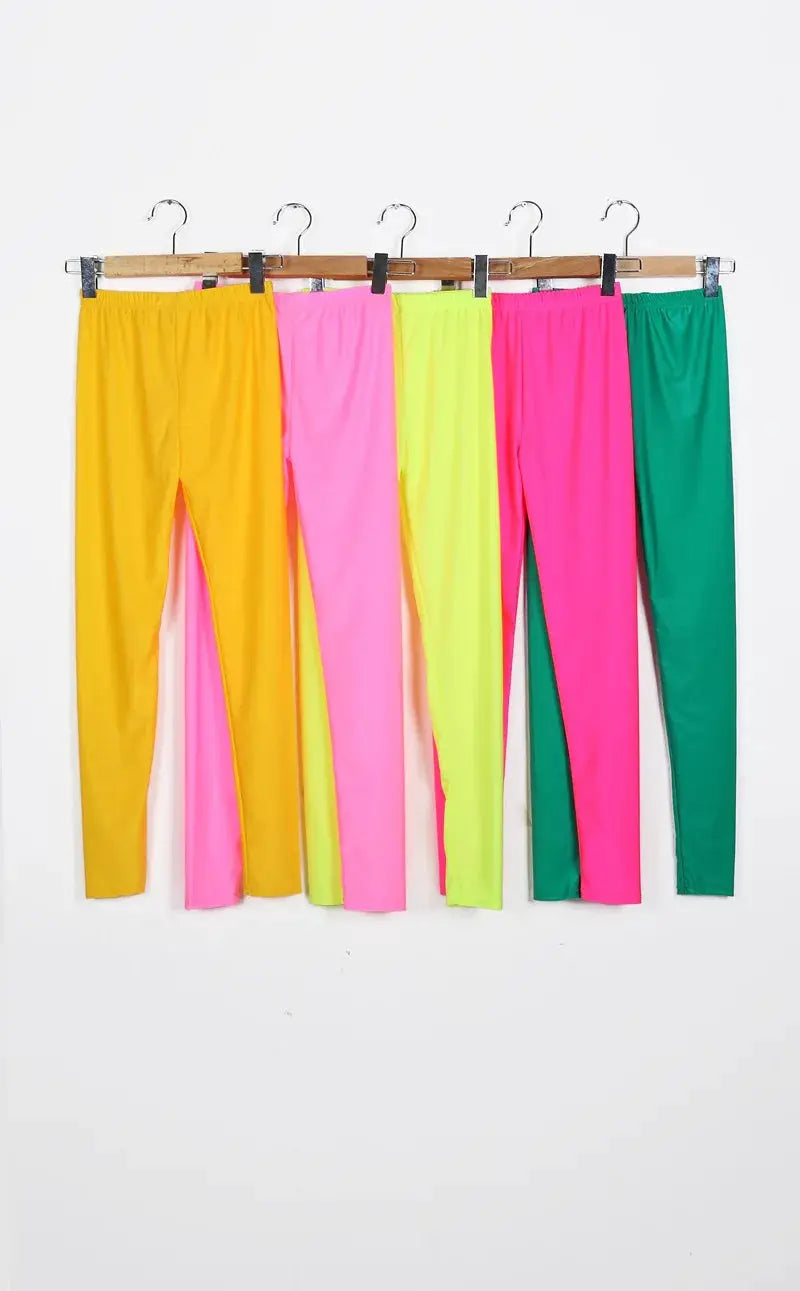 Womens shiny leggings in neon colors, made of spandex; 6 pairs on hangers