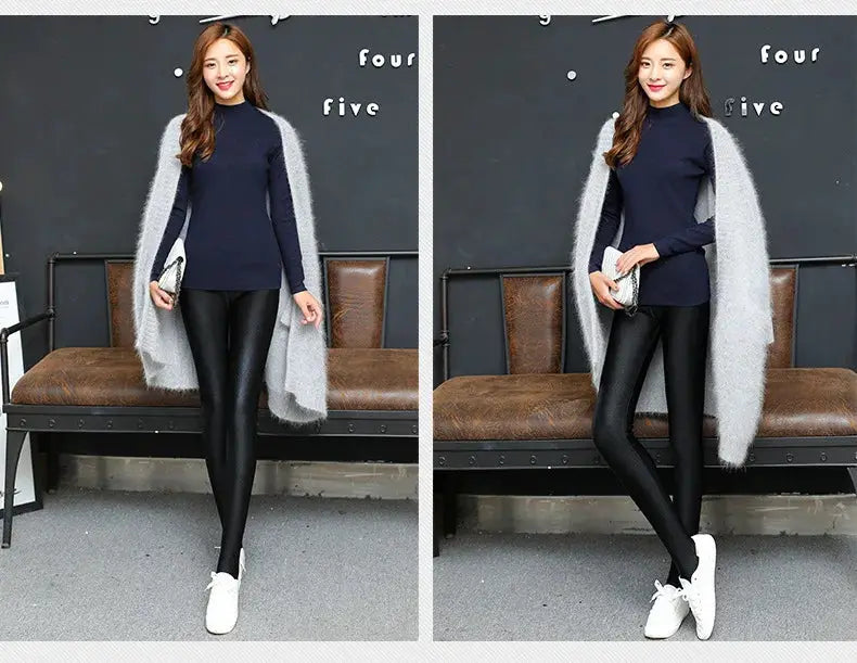 Leggings for women; black shiny stretch pants paired with a navy top and grey oversized cardigan