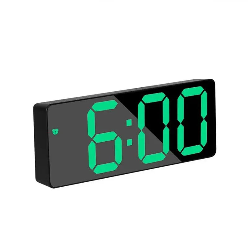 Digital alarm clock with black acrylic mirror front and bright green LED digits.