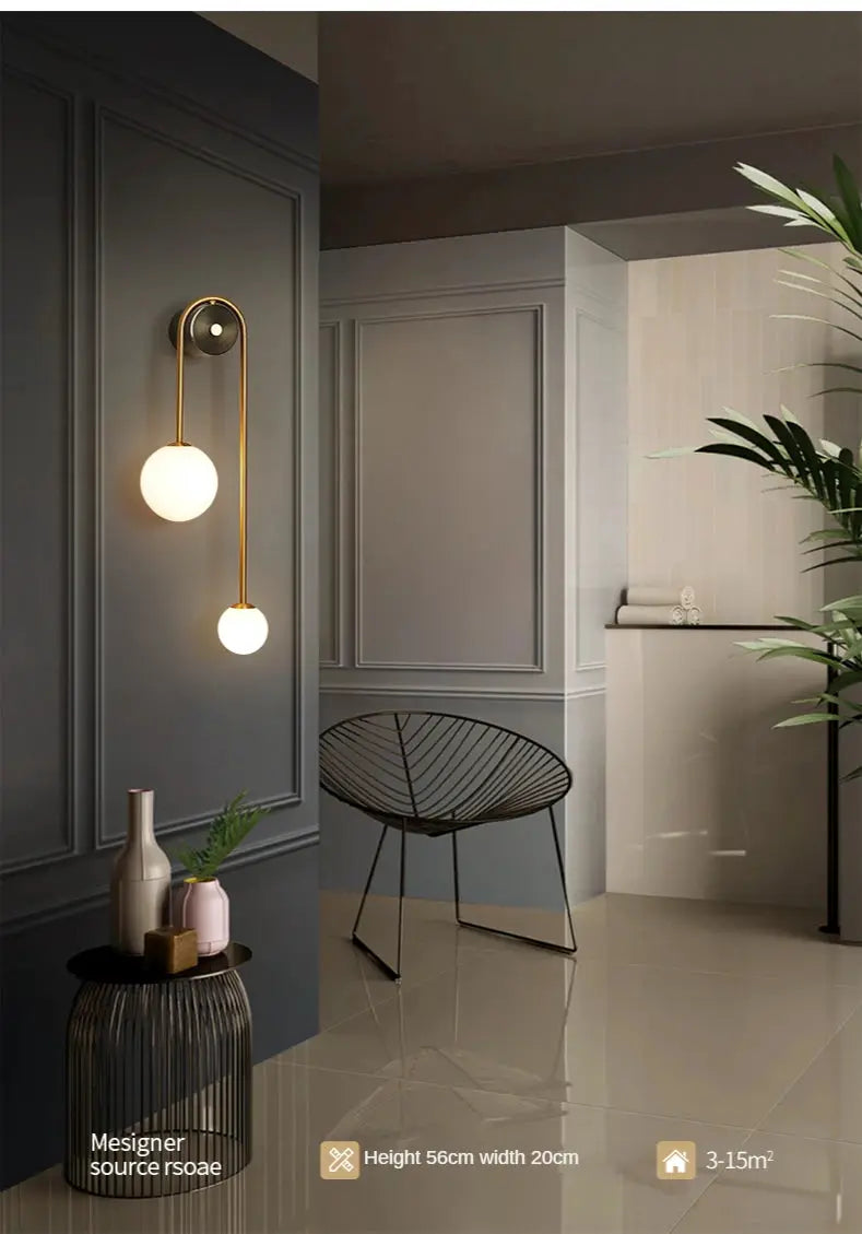 Modern wall lamp with glass ball shades, gold finish, LED double-globe sconce