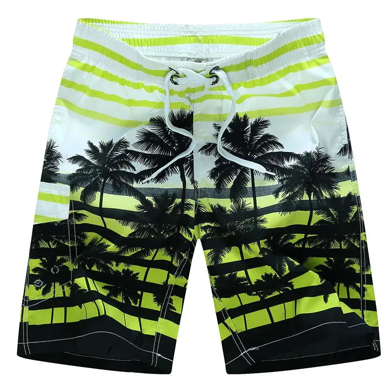 Men's surf board shorts with neon lime green to black palm-tree pattern and drawstring waist