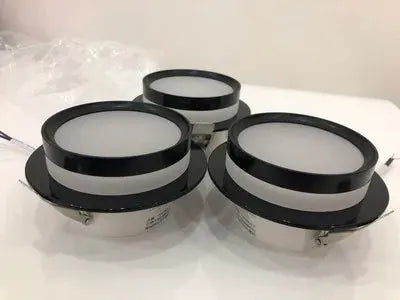 Three chrome round recessed LED downlights with acrylic diffusers