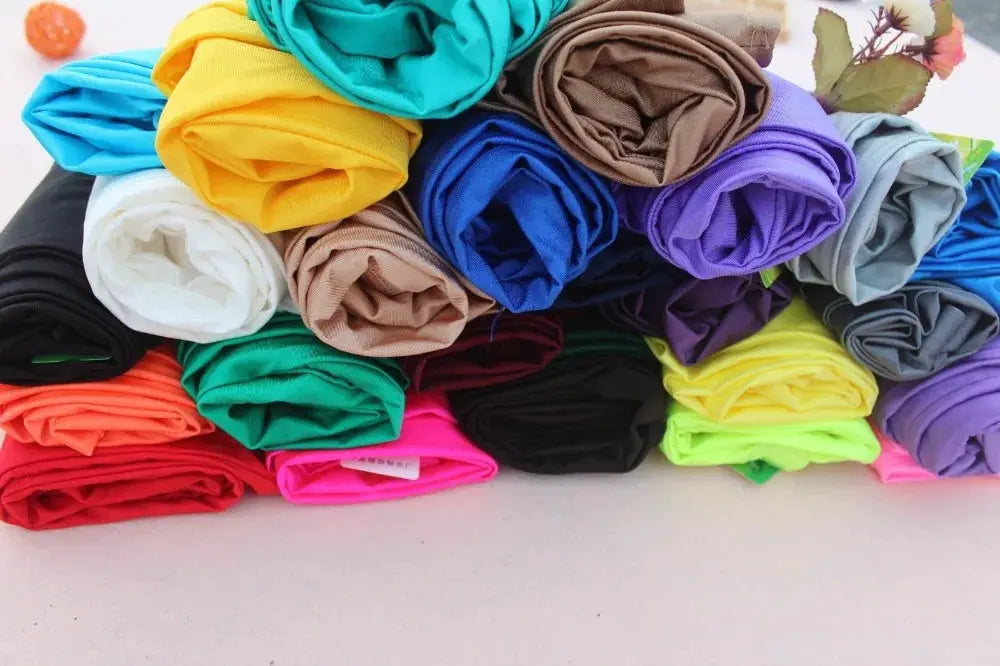 Women's shiny leggings in assorted neon and pastel colors; stretchy spandex